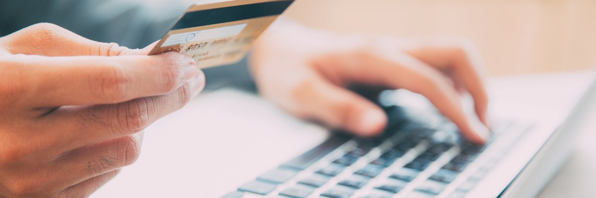 Man making online purchase with credit card