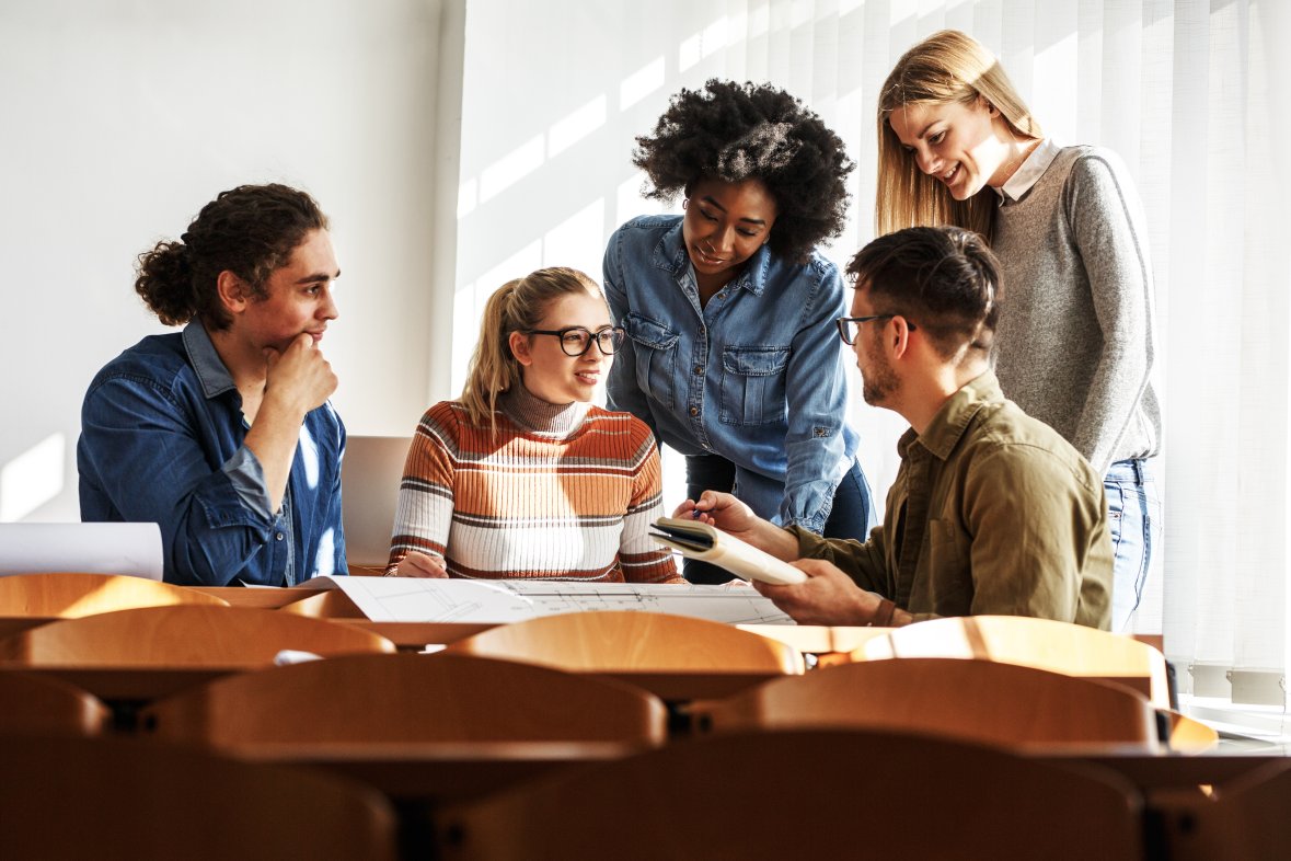 Group of design students in the classroom. Group of design students in the classroom.
