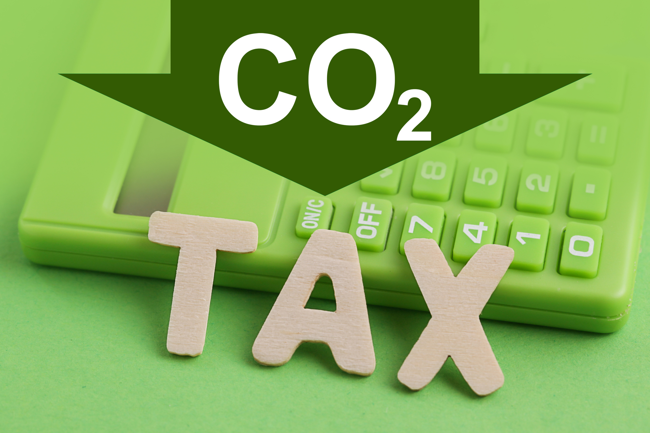 CO2 Decarbonisation. Sustainability tax. Green Calculator on green background. Clean Green Energy CO2 Decarbonisation. Sustainability tax. Green Calculator on green background. Clean Green Energy