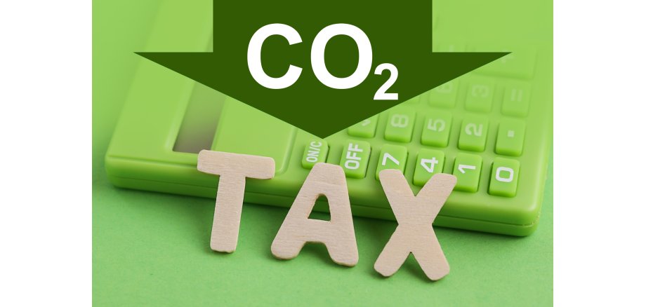 CO2 Decarbonisation. Sustainability tax. Green Calculator  on green background. Clean Green Energy