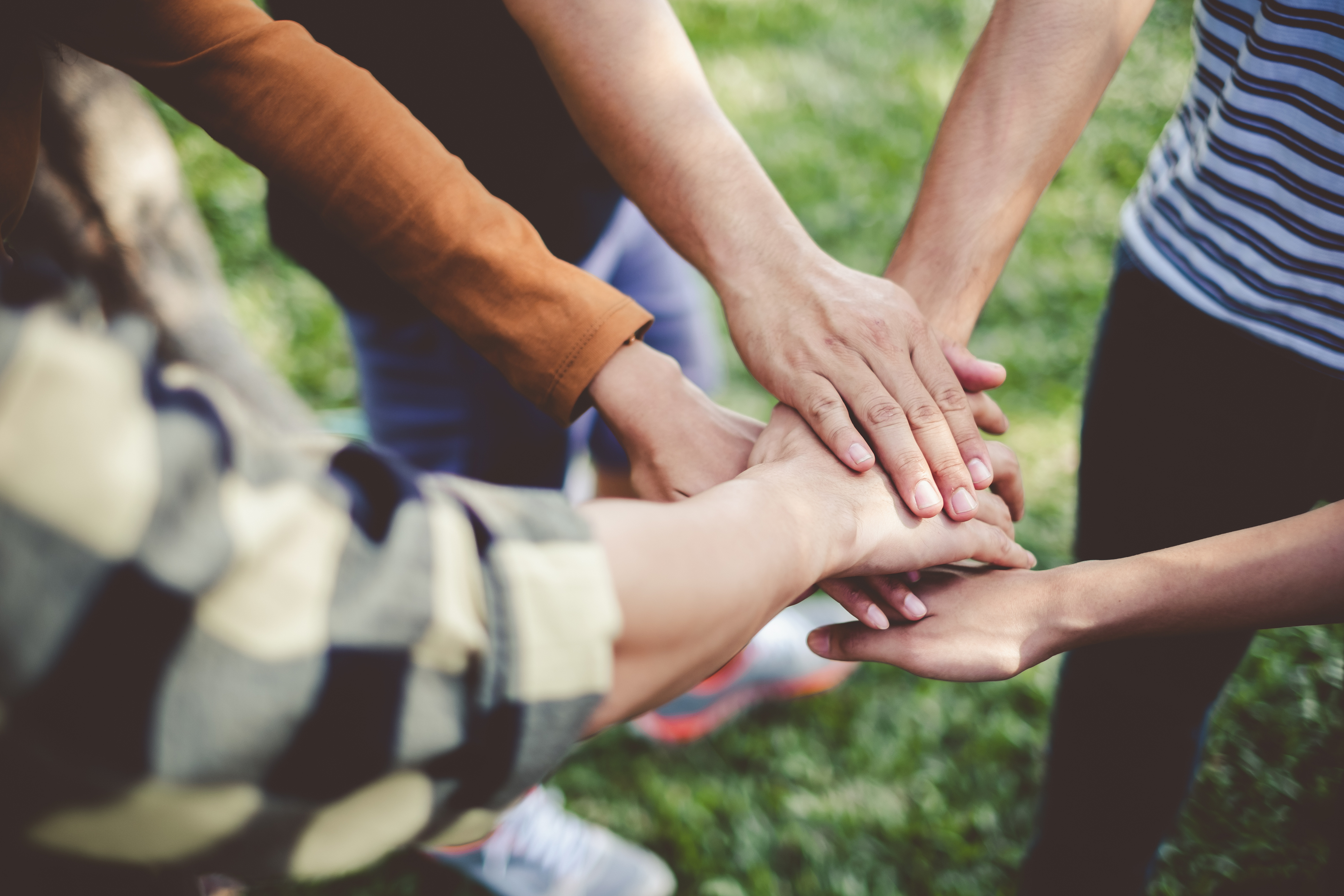 Stacking hands of young teen student, teamwork, togetherness and cooperation concept Stacking hands of young teen student, teamwork, togetherness and cooperation concept