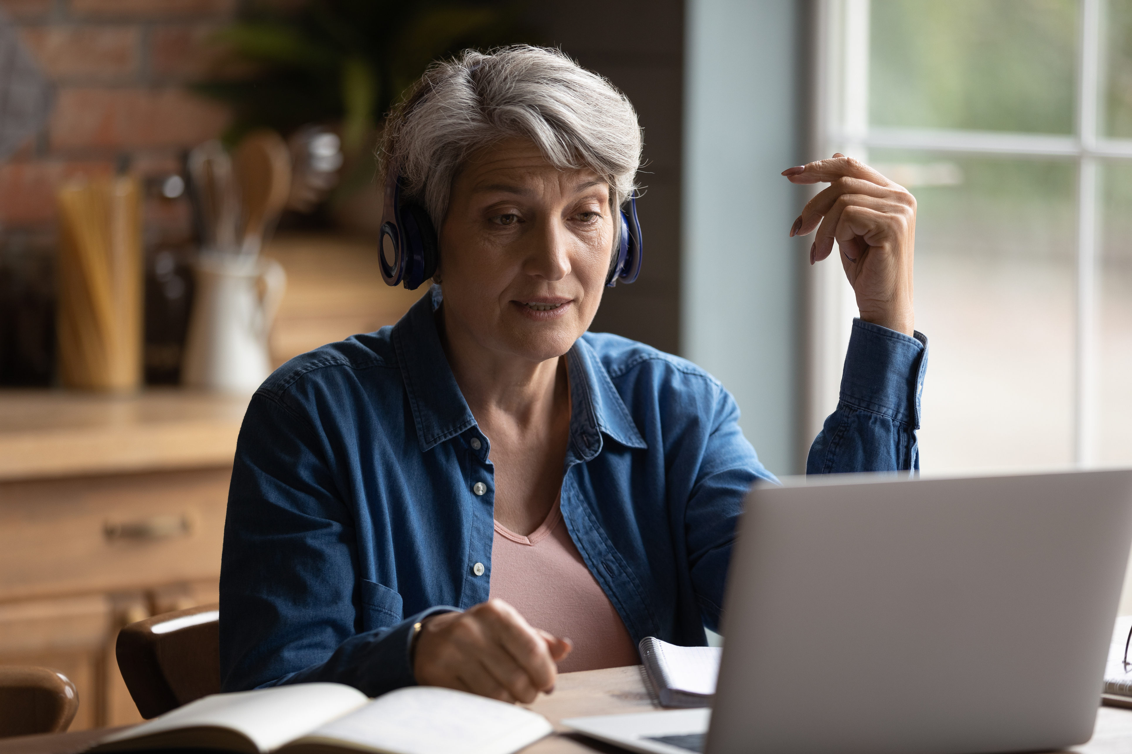 Focused middle aged mature woman studying distantly. Focused middle aged mature woman studying distantly.