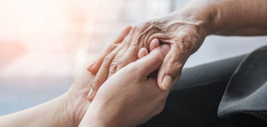 Parkinson disease patient, Alzheimer elderly senior, Arthritis person hand in support of nursing family caregiver care for disability awareness day, National care givers month, ageing society concept