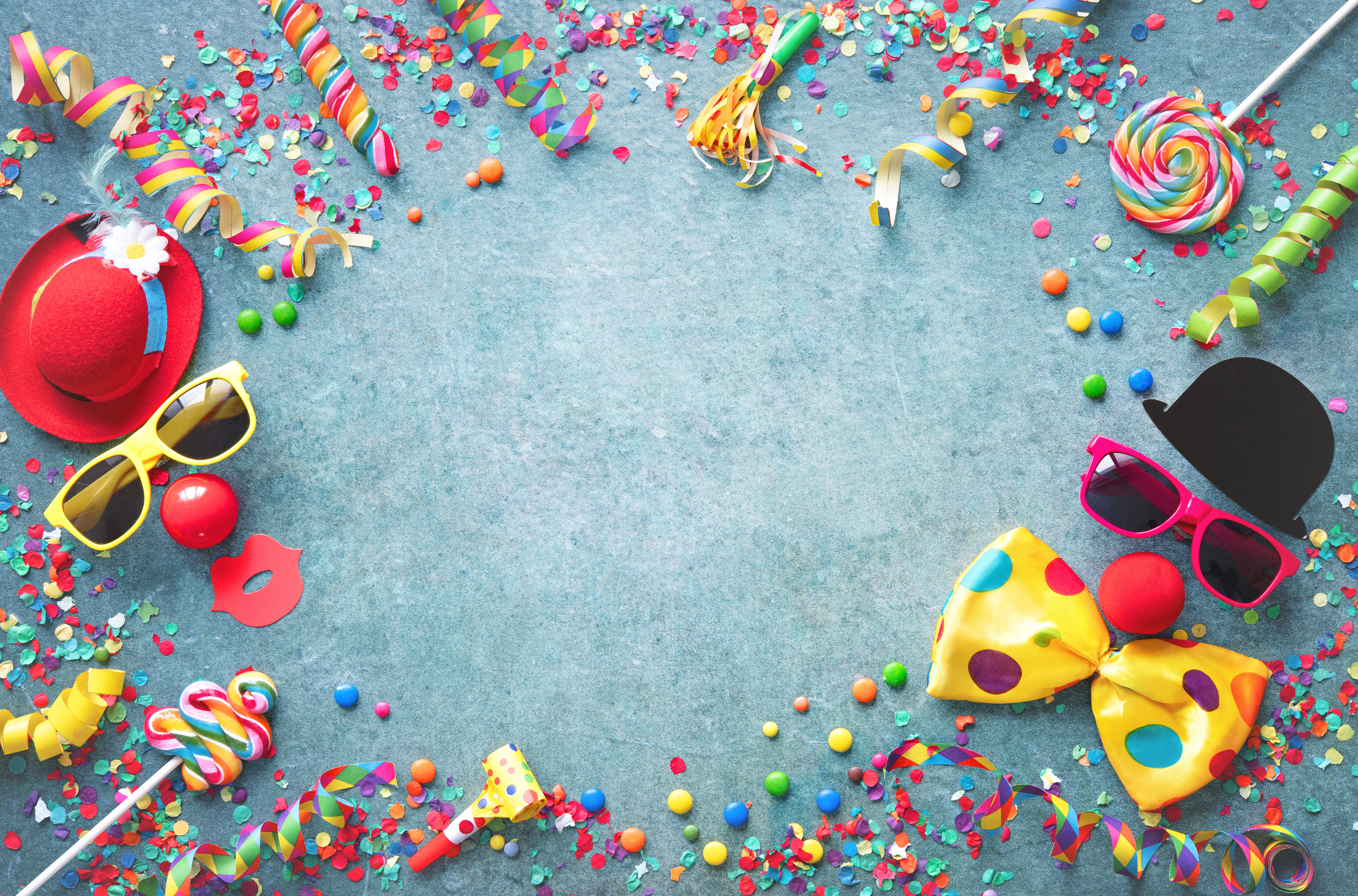 Colorful carnival or party background streamers and confetti and funny faces Colorful carnival or party background streamers and confetti and funny faces