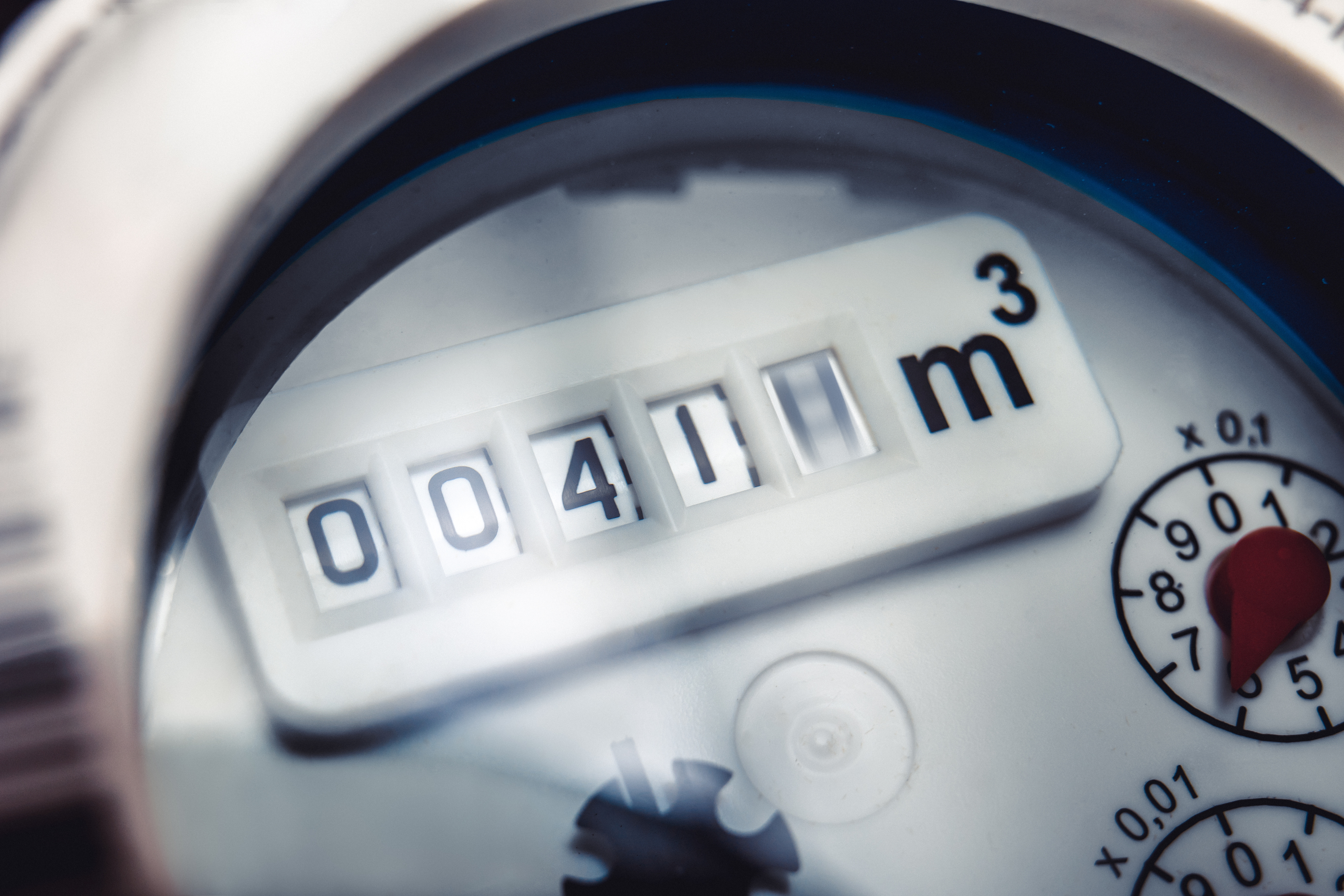 Close up of water meter with rotating digit. Close up of water meter with rotating digit.