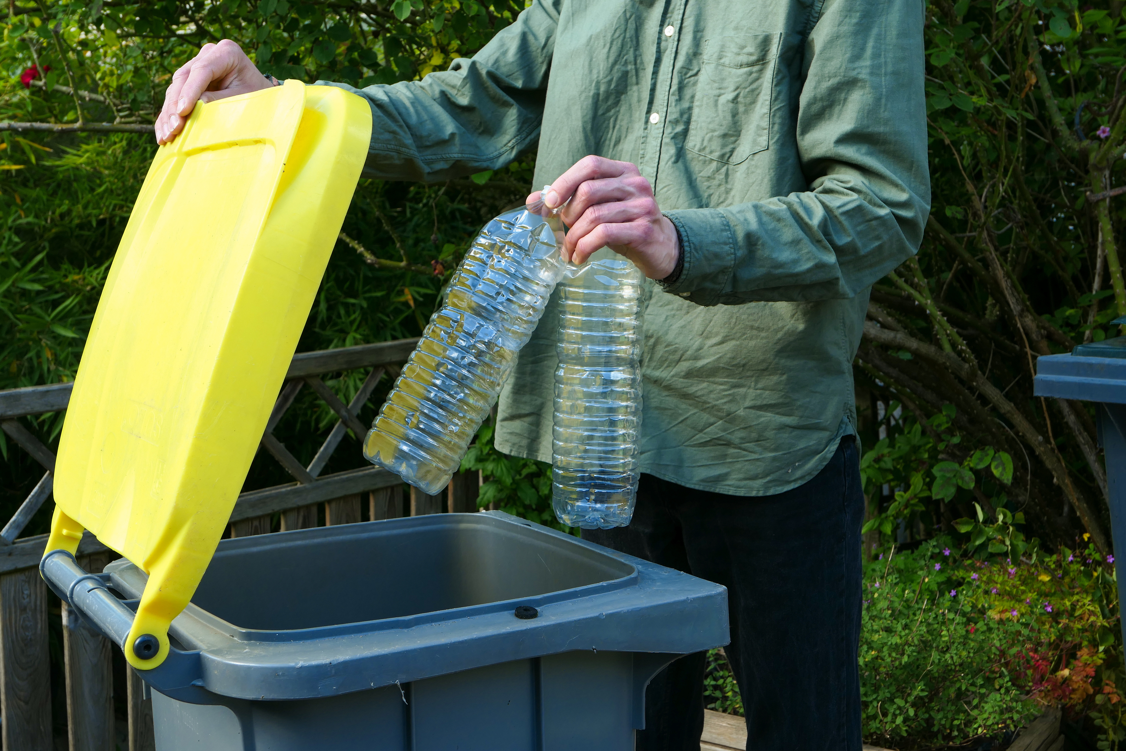 One person making a selective sorting of waste. One person making a selective sorting of waste.