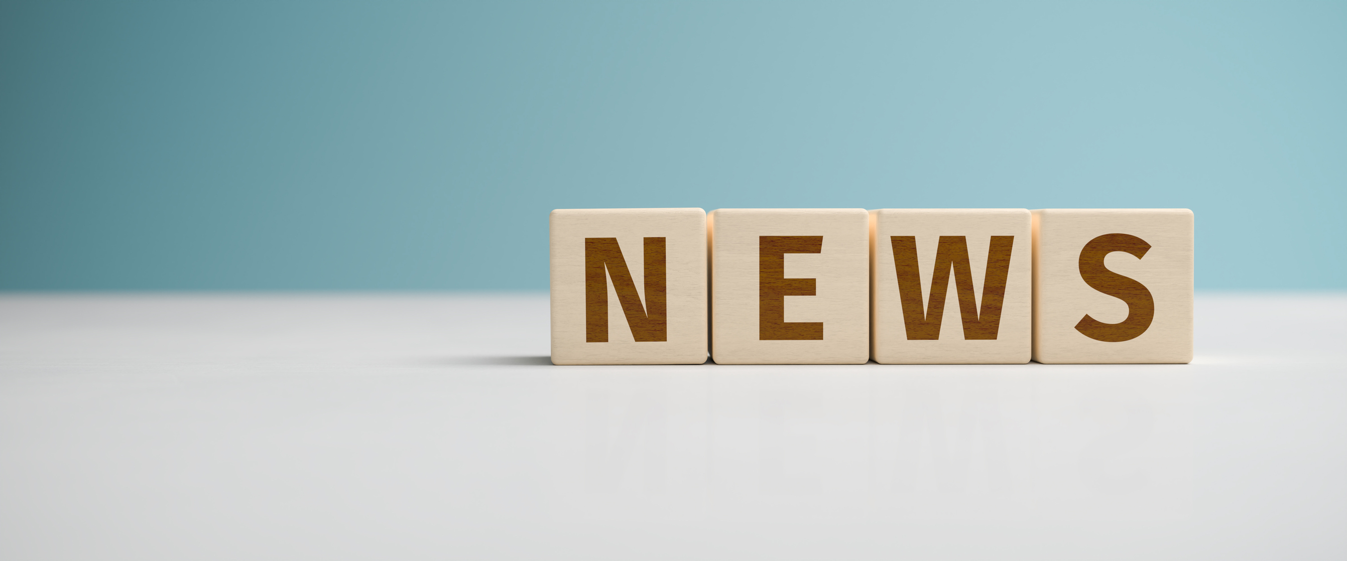 "News" web banner - the word "News" built from letters on wooden cubes for the use as a web banner. "News" web banner - the word "News" built from letters on wooden cubes for the use as a web banner.