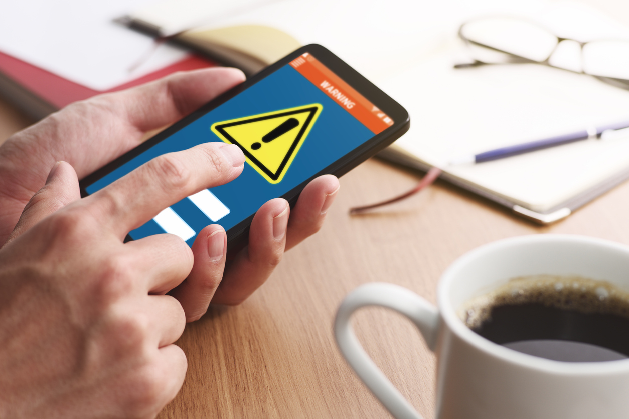 Security alert on smartphone display. Virus infected smartphone concept. Security alert on smartphone display. Virus infected smartphone concept.