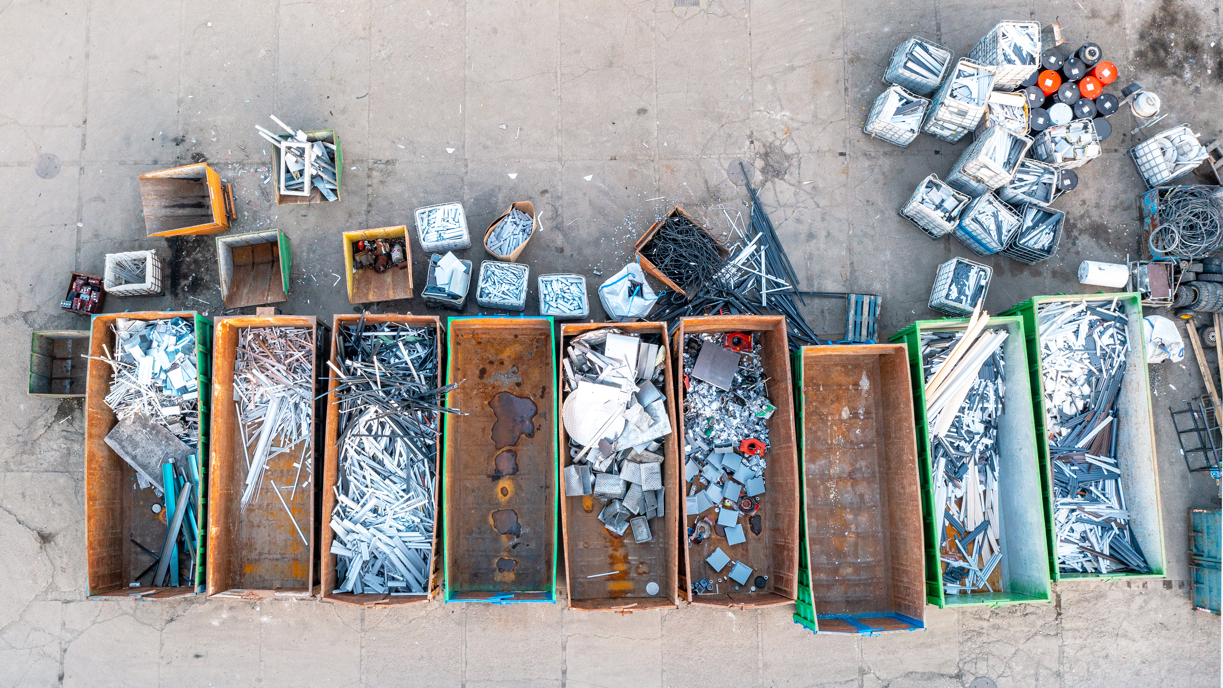 Containers from a height with different types of metal, Sorting for remelting metal products Containers from a height with different types of metal, Sorting for remelting metal products
