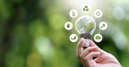 ESG Banners - Environment, Society and Governance hand holding light bulb with renewable energy icon Revolving Revenue ESG Banners - Environment, Society and Governance hand holding light bulb with renewable energy icon Revolving Revenue
