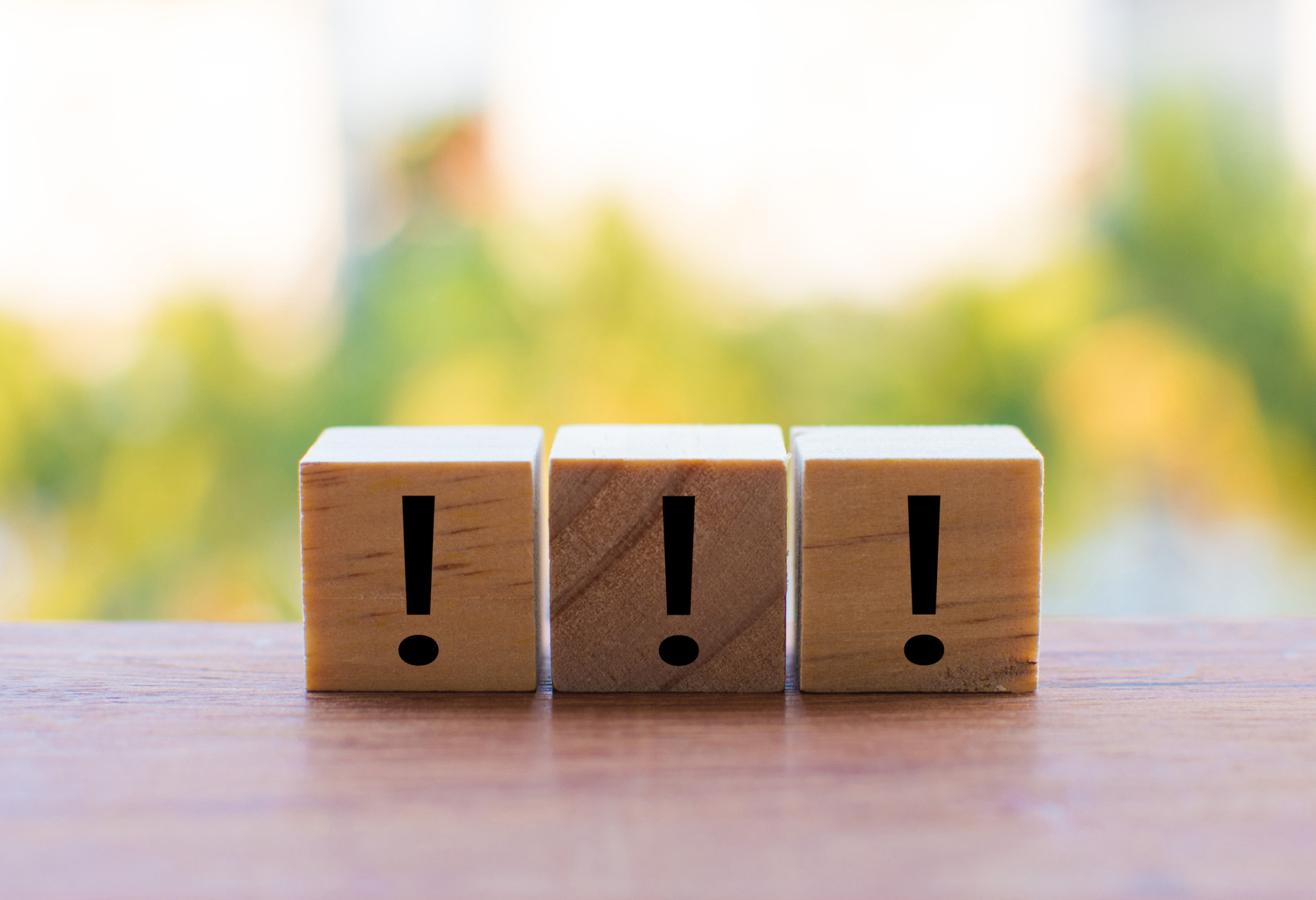 3 wooden dice arranged in an exclamation mark 3 wooden dice arranged in an exclamation mark