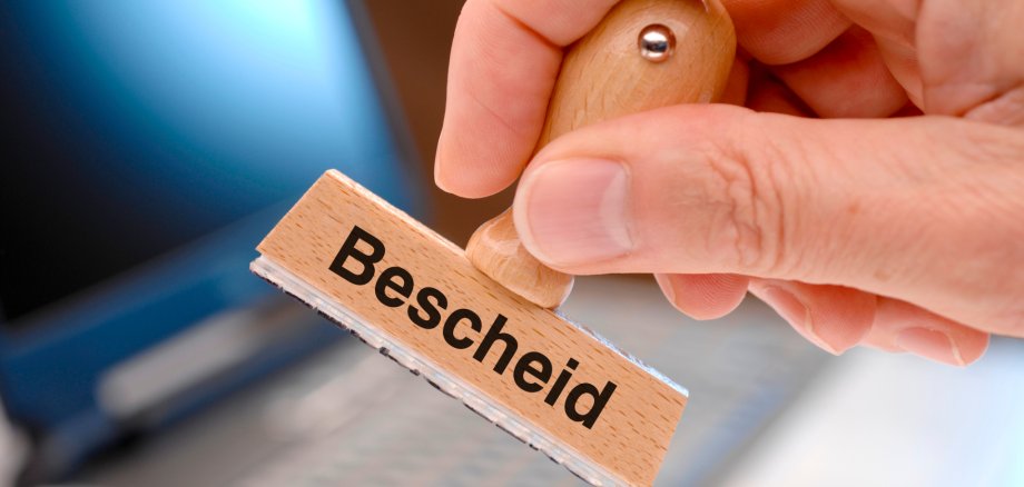 Bescheid printed on German stamp - in English language: assessment