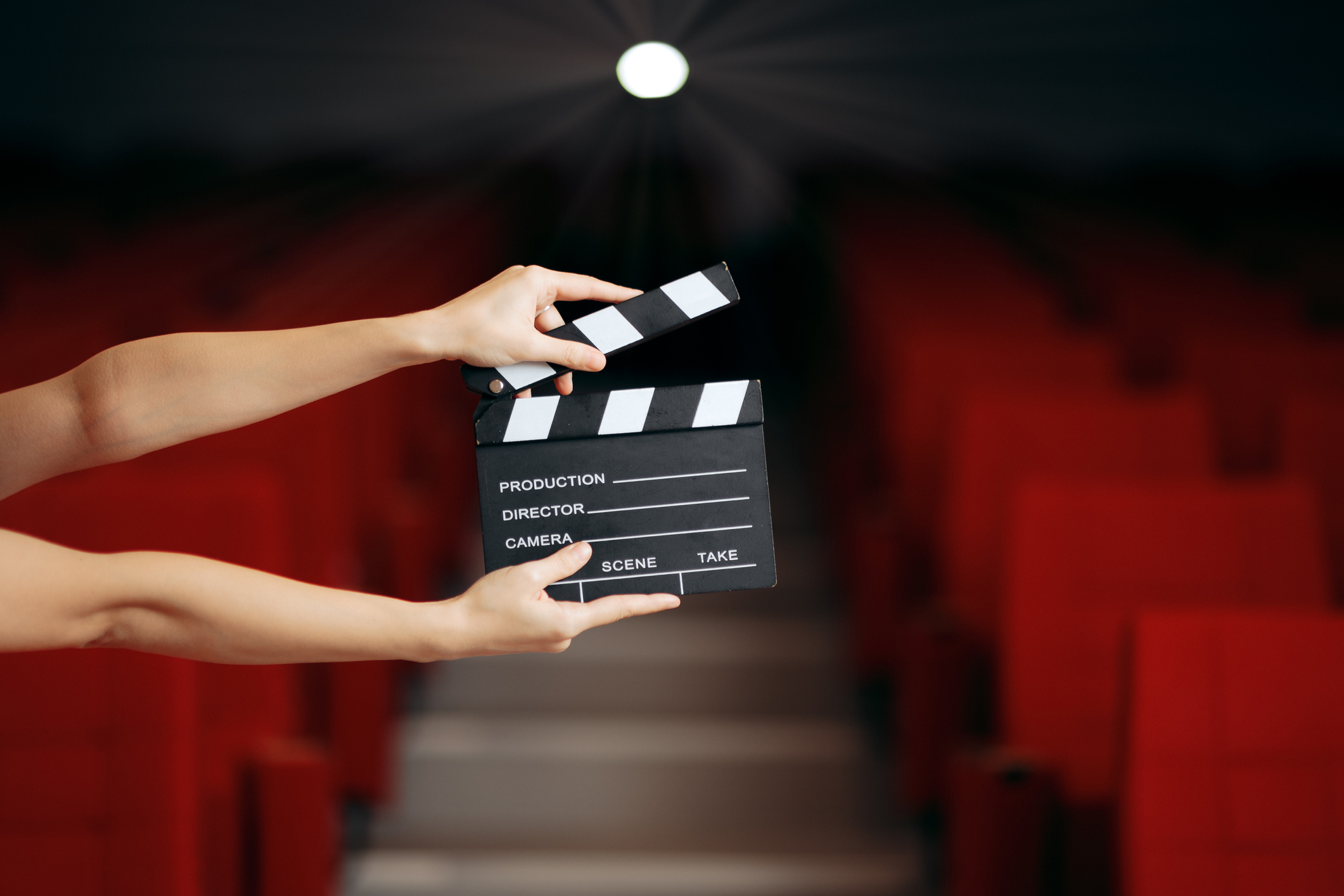 Hands Holding Director Movie Clapper in Cinema Theatre Hands Holding Director Movie Clapper in Cinema Theatre