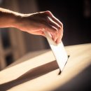 Conceptual image of a person voting during elections