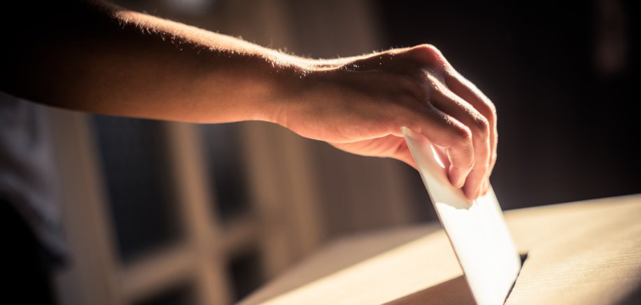 Conceptual image of a person voting during elections