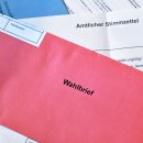 Red German postal voting envelope with German text saying 'voting letter'