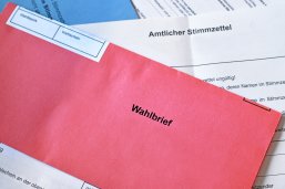 Red German postal voting envelope with German text saying 'voting letter' Red German postal voting envelope with German text saying 'voting letter'