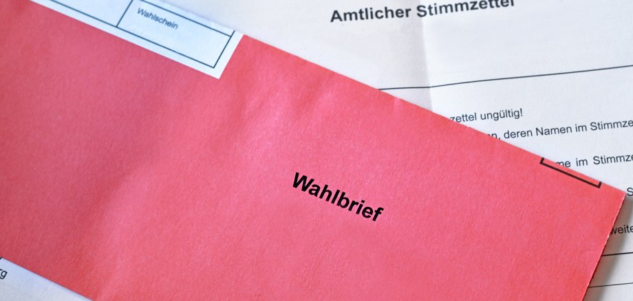Red German postal voting envelope with German text saying 'voting letter'