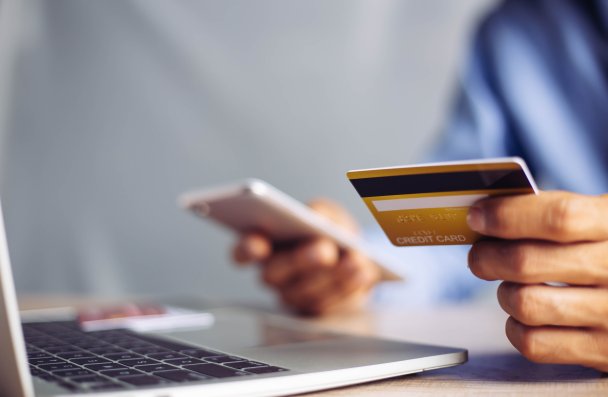 Online payment hands holding credit card and using laptop. Online shopping concept.